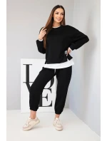 Dámský komplet s volnou mikinou a tepláky černý model 21808615 - K-Fashion Dámský komplet s volnou mikinou a tepláky černý model 21808615 - K-Fashion