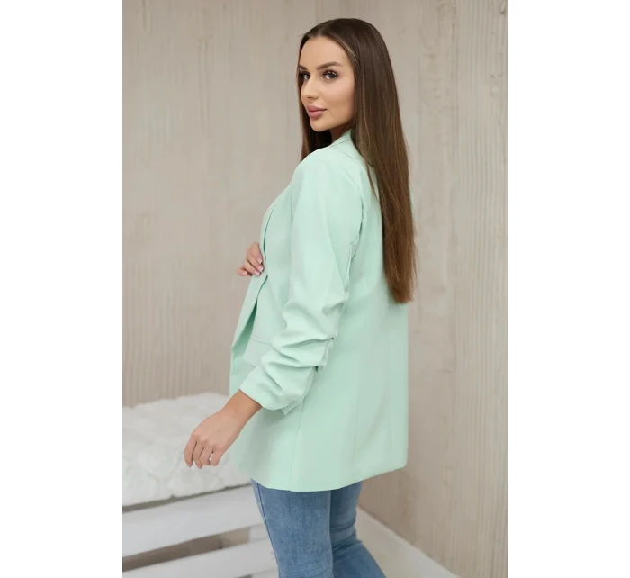 Bunda s klopou elegantná svetlá mentolová Bunda s klopou elegantná svetlá mentolová