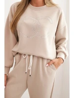 Dámska súprava z viskózy s ozdobným motívom a nohavicami béžová Dámska súprava z viskózy s ozdobným motívom a nohavicami béžová