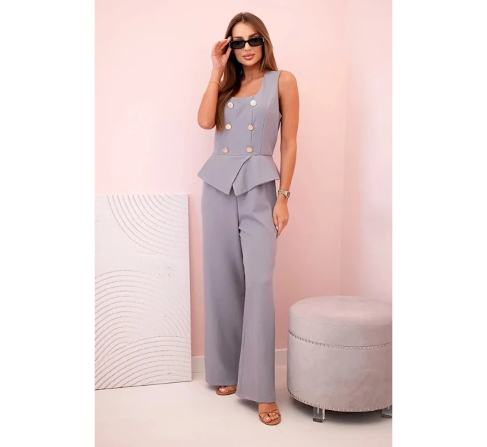 Dámská kombinéza bez rukávů s širokými nohavicemi a ozdobnými knoflíky šedý Dámská kombinéza bez rukávů s širokými nohavicemi a ozdobnými knoflíky šedý