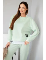 Dámska súprava s maslovou farbou, voľnou mikinou a teplákmi svetlej mentolovej farby Dámska súprava s maslovou farbou, voľnou mikinou a teplákmi svetlej mentolovej farby