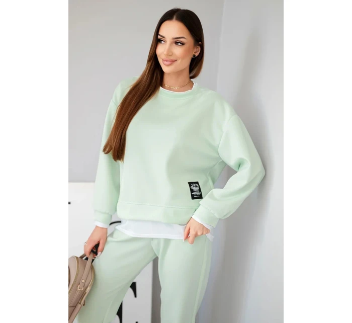 Dámska súprava s maslovou farbou, voľnou mikinou a teplákmi svetlej mentolovej farby Dámska súprava s maslovou farbou, voľnou mikinou a teplákmi svetlej mentolovej farby