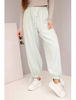 Dámske nohavice so širokými nohavicami a viazaním v spodnej časti tmavá mentolová