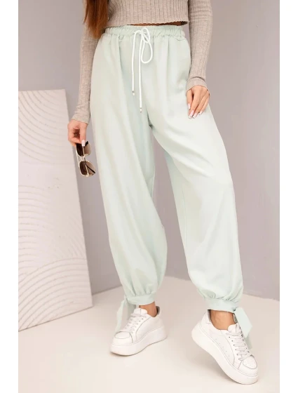 Dámske nohavice so širokými nohavicami a viazaním v spodnej časti tmavá mentolová