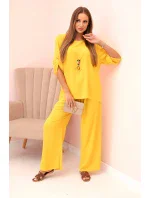 Dámska súprava s blúzkou s náhrdelníkom a širokými nohavicami žltá Dámska súprava s blúzkou s náhrdelníkom a širokými nohavicami žltá