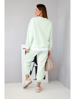 Dámska súprava s maslovou farbou, voľnou mikinou a teplákmi svetlej mentolovej farby Dámska súprava s maslovou farbou, voľnou mikinou a teplákmi svetlej mentolovej farby