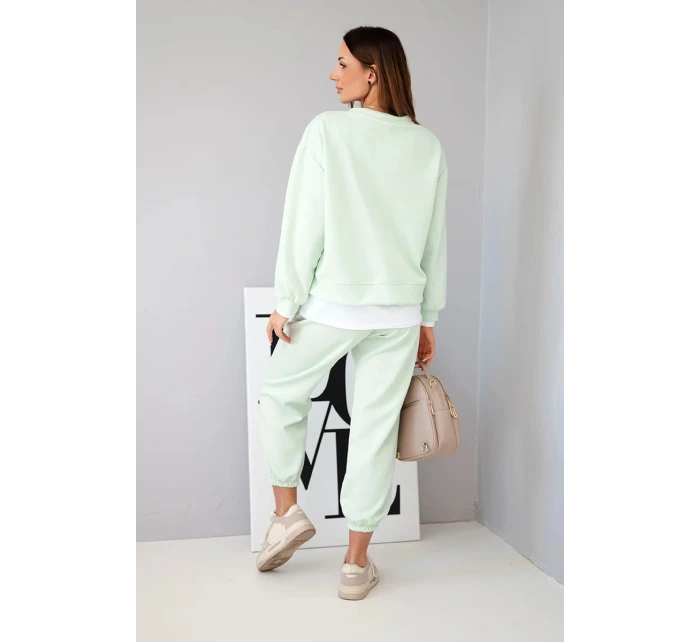 Dámska súprava s maslovou farbou, voľnou mikinou a teplákmi svetlej mentolovej farby Dámska súprava s maslovou farbou, voľnou mikinou a teplákmi svetlej mentolovej farby