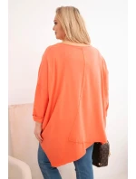 Dámska bavlnená blúzka s asymetrickým lemom a výstrihom do V v marhuľovej farbe Dámska bavlnená blúzka s asymetrickým lemom a výstrihom do V v marhuľovej farbe