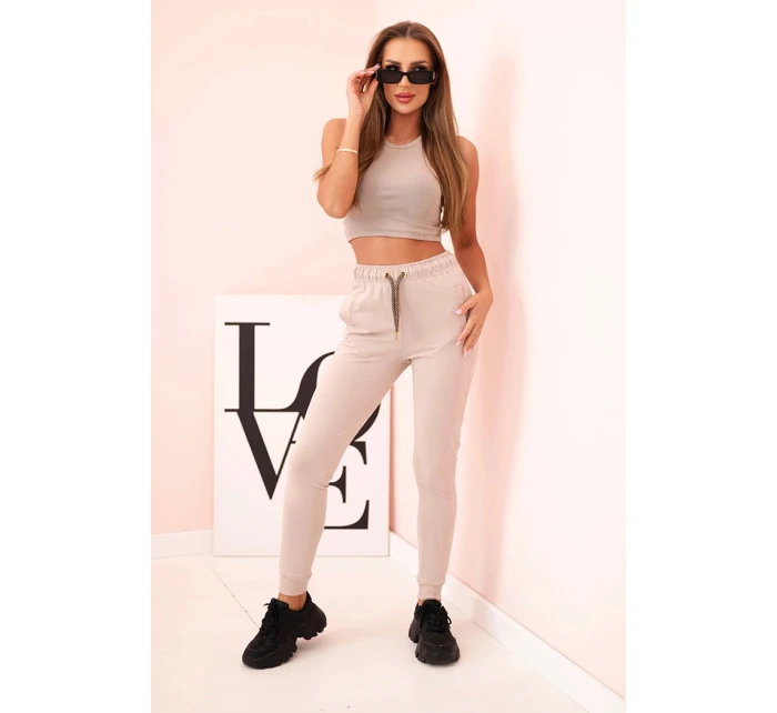 Dámské bavlněné cargo kalhoty s kapsami a řetízkem béžové