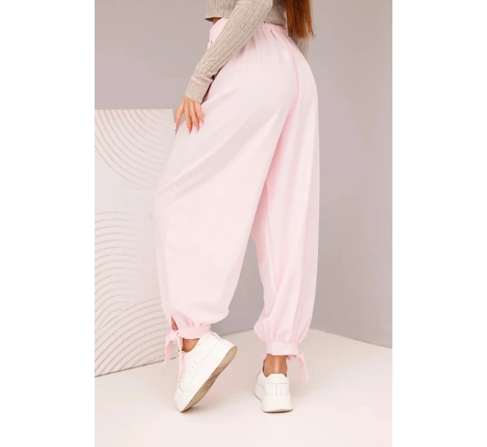 Dámske nohavice so širokými nohavicami a viazaním v spodnej časti candy pink