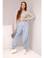 Dámske nohavice so širokými nohavicami a viazaním v spodnej časti džínsovo modré