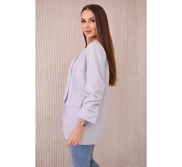 Šedé sako s elegantnými klopami