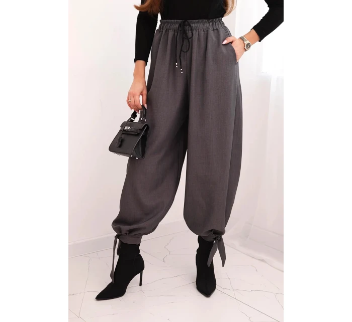 Dámske nohavice so širokými nohavicami a viazaním v spodnej časti graphite Dámske nohavice so širokými nohavicami a viazaním v spodnej časti graphite