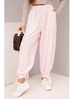 Dámske nohavice so širokými nohavicami a viazaním v spodnej časti candy pink