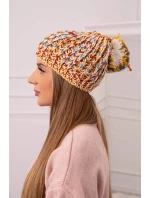 Dámská čepice s bambulí hořčicová model 18751893 - K-Fashion Dámská čepice s bambulí hořčicová model 18751893 - K-Fashion