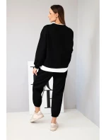 Dámský komplet s volnou mikinou a tepláky černý model 21808615 - K-Fashion Dámský komplet s volnou mikinou a tepláky černý model 21808615 - K-Fashion