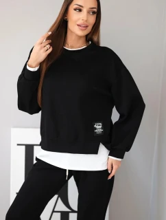 Dámska súprava s maslovou farbou, voľnou mikinou a teplákmi čiernej farby