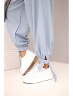 Dámske nohavice so širokými nohavicami a viazaním v spodnej časti džínsovo modré