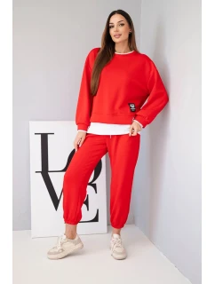 Dámska súprava maslovej farby s voľnou mikinou a teplákmi červená