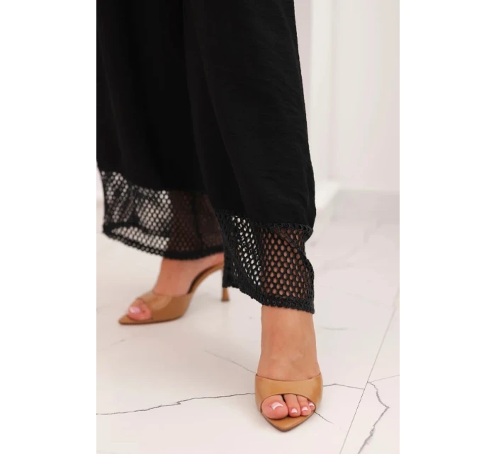 Dámska súprava z viskózy, top so širokými ramienkami a nohavice so širokým strihom čiernej farby Dámska súprava z viskózy, top so širokými ramienkami a nohavice so širokým strihom čiernej farby