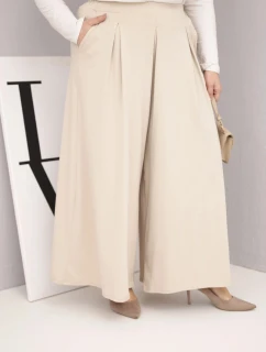 Dámske bavlnené nohavice nadmernej veľkosti so širokými nohavicami a voľným strihom béžovej farby