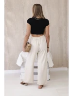 Široké nohavice béžovej farby