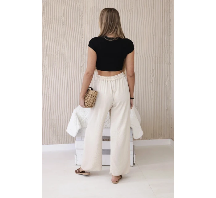 Široké nohavice béžovej farby