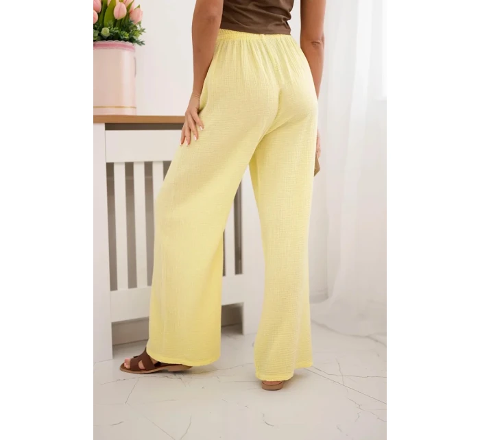Mušelínové nohavice so širokými nohavicami žltej farby