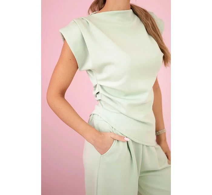 Asymetrická blúzka + nohavice svetlá mentolová
