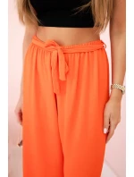 Široké nohavice v páse tmavo oranžové Široké nohavice v páse tmavo oranžové