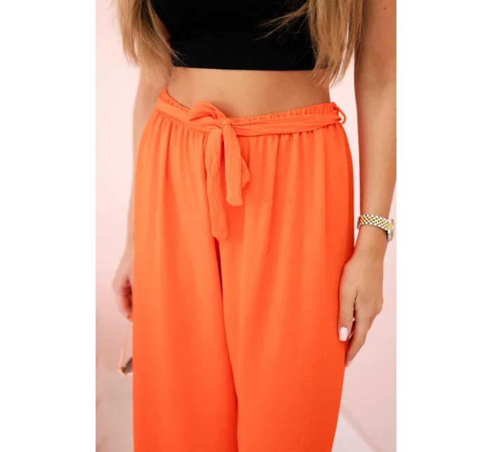 Široké nohavice v páse tmavo oranžové Široké nohavice v páse tmavo oranžové