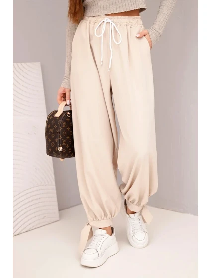 Dámske široké nohavice so zaväzovaním v spodnej časti béžové
