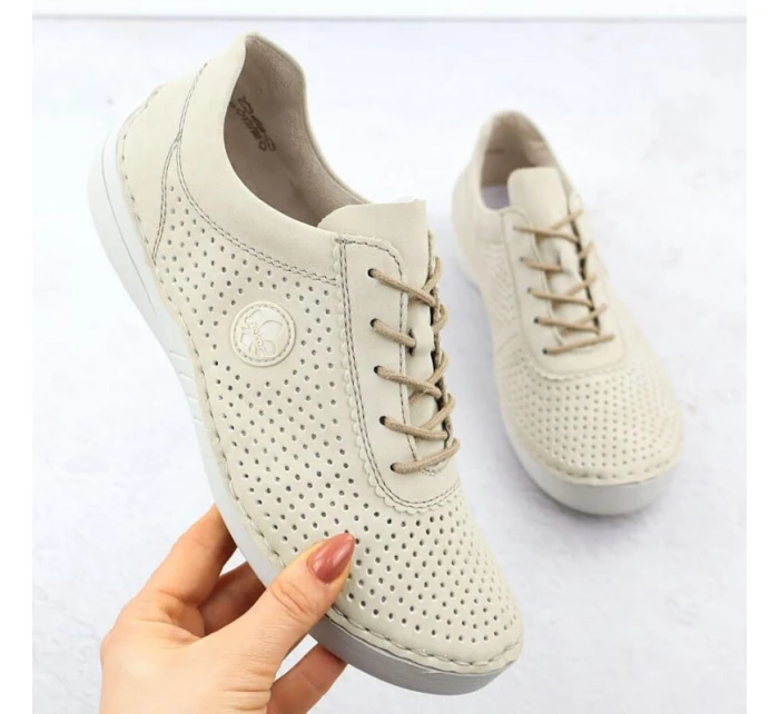 Dámske perforované béžové kožené poltopánky Rieker 52546-60