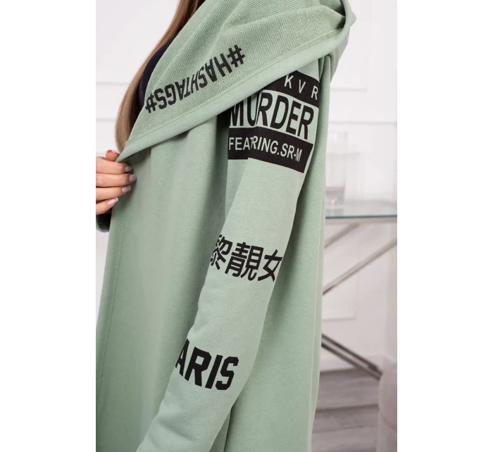 Pláštěnka světle mátové barvy s nápisy