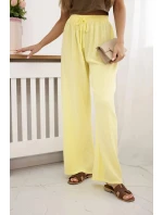 Mušelínové nohavice so širokými nohavicami žltej farby