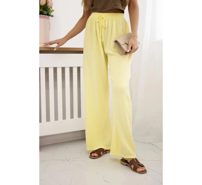 Mušelínové nohavice so širokými nohavicami žltej farby