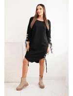 Dámske asymetrické šaty s ozdobnými pásmi a 3/4 rukávmi modrej farby Dámske asymetrické šaty s ozdobnými pásmi a 3/4 rukávmi modrej farby