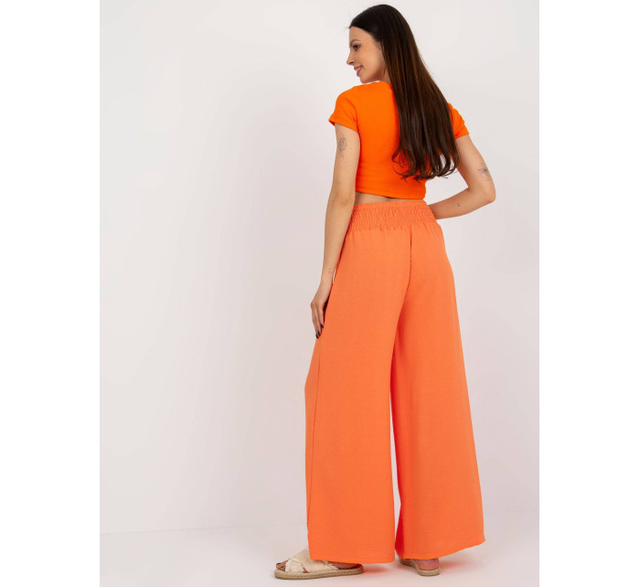 Oranžové dámske nohavice so širokým pásom (8390)