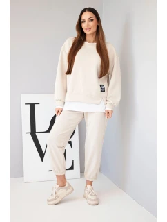 Dámska súprava s maslovou mikinou a voľnými teplákmi béžová