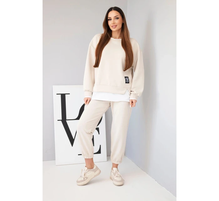 Dámska súprava s maslovou mikinou a voľnými teplákmi béžová Dámska súprava s maslovou mikinou a voľnými teplákmi béžová