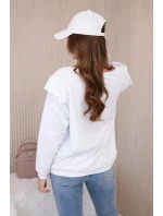 Bavlnená blúzka s volánikmi na ramenách biela Bavlnená blúzka s volánikmi na ramenách biela