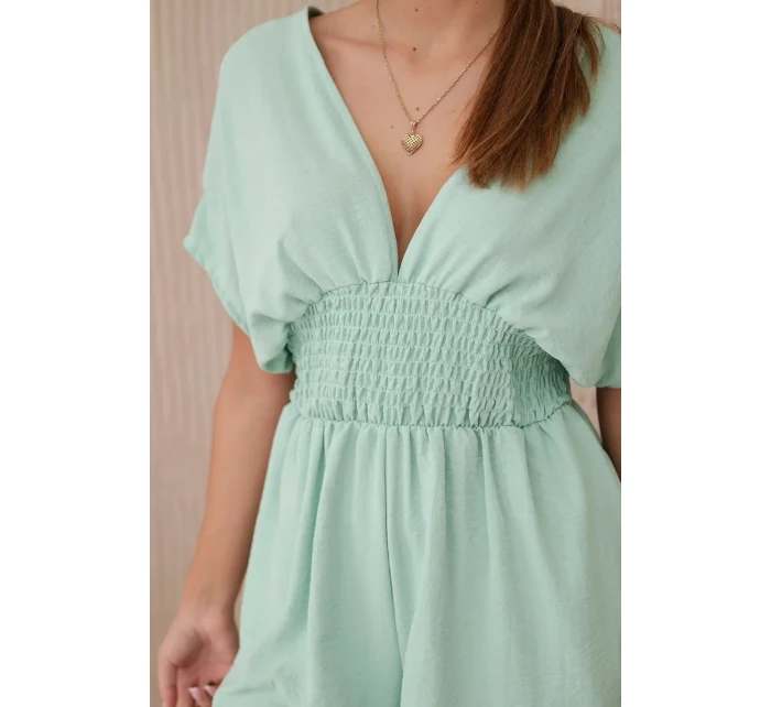Kombinéza s volánikmi v páse tmavá mentolová