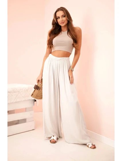 Dámske široké viskózové nohavice s elastickým pásom béžovej farby Dámske široké viskózové nohavice s elastickým pásom béžovej farby