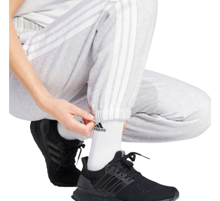 Adidas Essentials 3-Stripes Fleece nohavice voľného strihu W IN6178 ženy Adidas Essentials 3-Stripes Fleece nohavice voľného strihu W IN6178 ženy