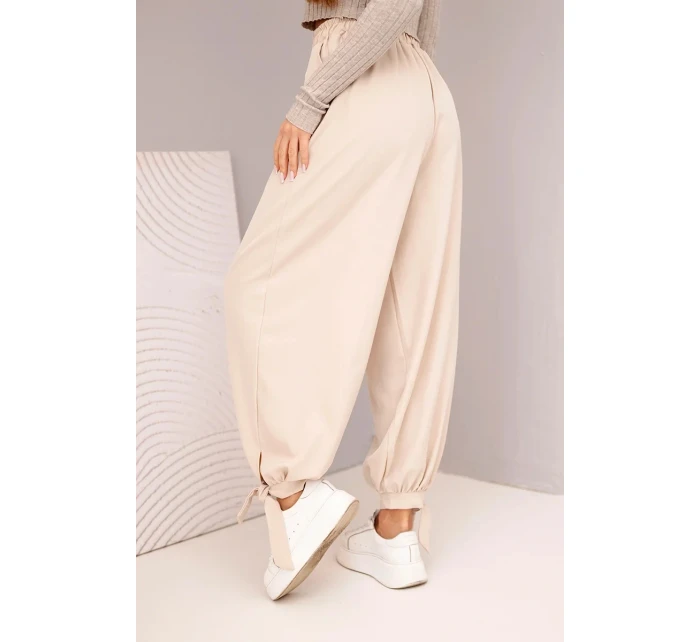 Dámske široké nohavice so zaväzovaním v spodnej časti béžové