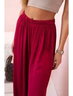 Široké dámské kalhoty s elastickým pasem tmavě vínová