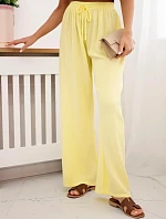 Mušelínové nohavice so širokými nohavicami žltej farby