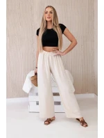 Široké nohavice béžovej farby