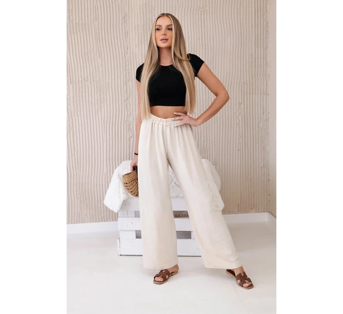 Široké nohavice béžovej farby