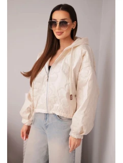 Dámska prešívaná bunda s kapucňou a ozdobným kvetinovým reliéfom béžová